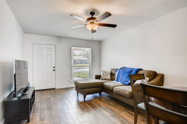 312 W William Cannon Dr, Austin, TX 78745 - living area with a ceiling fan, wood finished floors, and baseboards