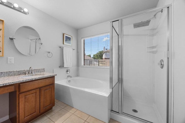 805 Meadow Bluff Ct, Round Rock, TX 78665 - full bathroom featuring a shower stall, a bath, vanity, and tile patterned flooring