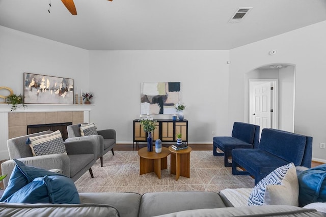 805 Meadow Bluff Ct, Round Rock, TX 78665 - living area featuring wood finished floors, a ceiling fan, baseboards, and arched walkways