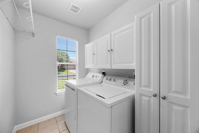 805 Meadow Bluff Ct, Round Rock, TX 78665 - laundry room with washing machine and dryer, cabinet space, baseboards, and light tile patterned flooring