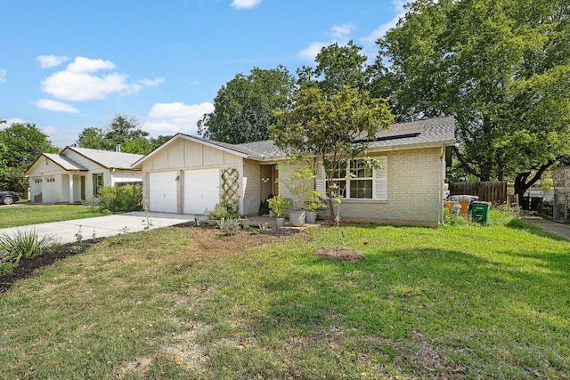 4708 Turnstone Dr, Austin, TX 78744 - view of front of house featuring roof mounted solar panels, a garage, board and batten siding, concrete driveway, and brick siding