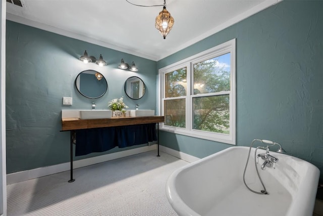 250 Porter Ln, Leander, TX 78641 - bathroom with double vanity and a freestanding bath