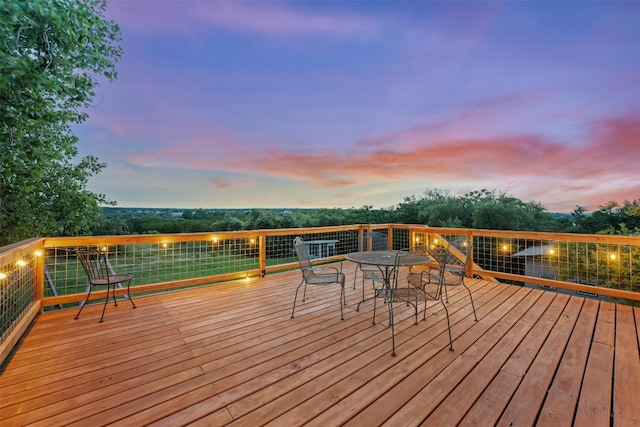 250 Porter Ln, Leander, TX 78641 - deck at dusk featuring outdoor dining area