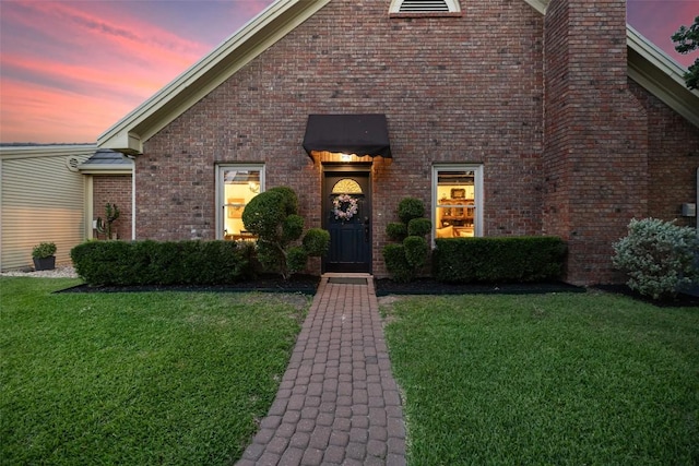 40 Tournament Way Unit G-32, The Hills, TX 78738 - view of front of house with a front lawn and brick siding