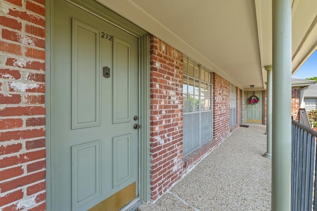 7920 Rockwood Ln Unit 232, Austin, TX 78757 - view of exterior entry with brick siding and covered porch