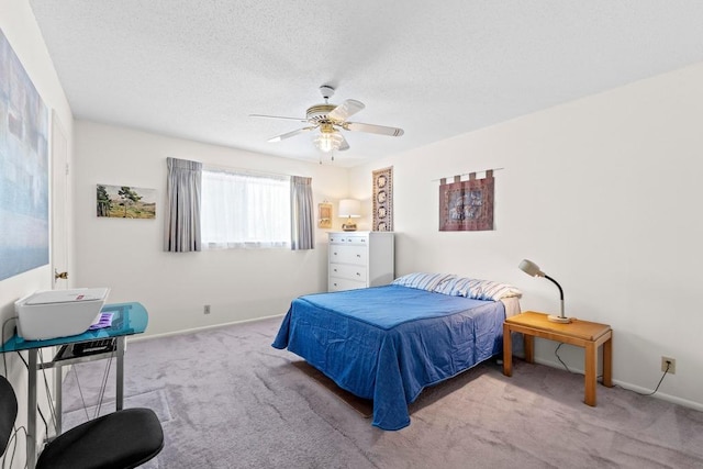 7920 Rockwood Ln Unit 232, Austin, TX 78757 - carpeted bedroom with baseboards, ceiling fan, and a textured ceiling