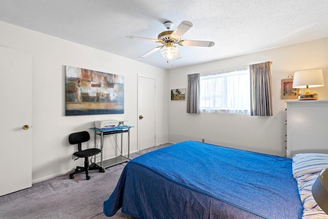 7920 Rockwood Ln Unit 232, Austin, TX 78757 - carpeted bedroom featuring a textured ceiling, a ceiling fan, and baseboards