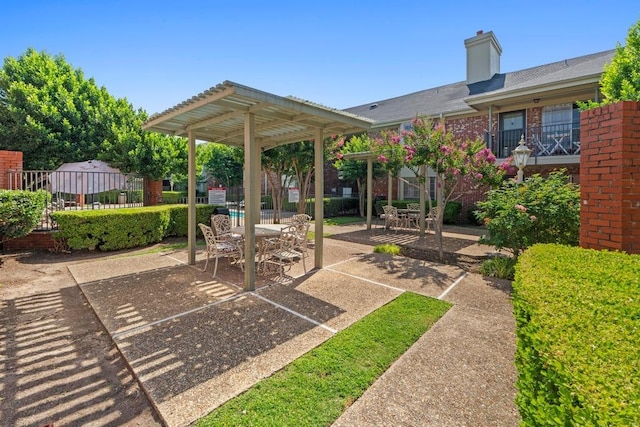 7920 Rockwood Ln Unit 232, Austin, TX 78757 - view of patio / terrace with a pergola and outdoor dining space