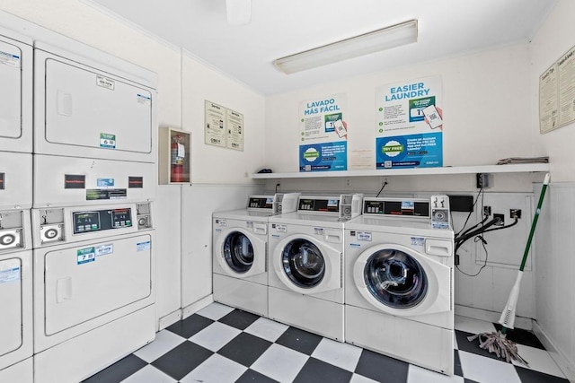 7920 Rockwood Ln Unit 232, Austin, TX 78757 - community laundry with tile patterned floors, stacked washer / drying machine, and washing machine and clothes dryer