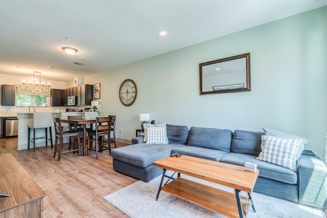 12160 Abbey Glen Ln, Austin, TX 78753 - living area with light wood-style floors, a chandelier, and recessed lighting