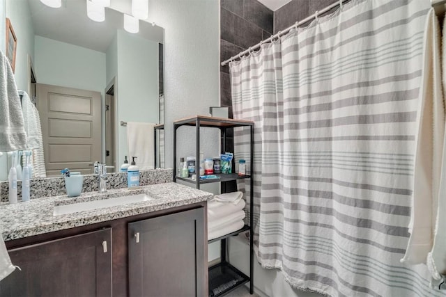 12160 Abbey Glen Ln, Austin, TX 78753 - bathroom featuring vanity and a textured wall