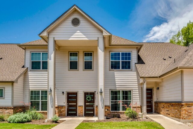 12160 Abbey Glen Ln, Austin, TX 78753 - view of front of home featuring brick siding and a shingled roof