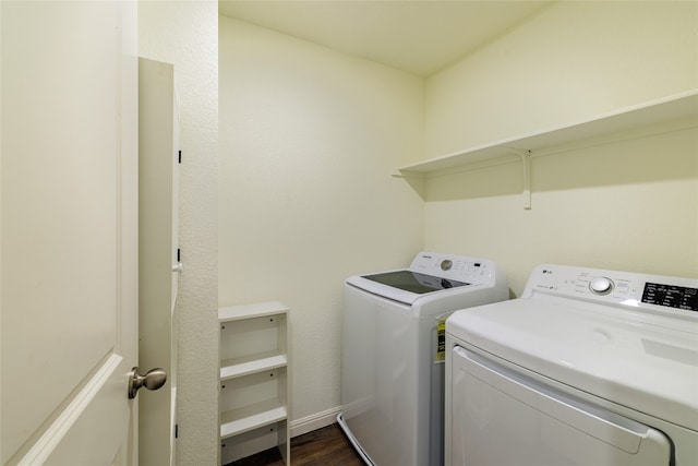301 Wonderful Life Way, Jarrell, TX 76537 - laundry room featuring independent washer and dryer and dark wood-type flooring