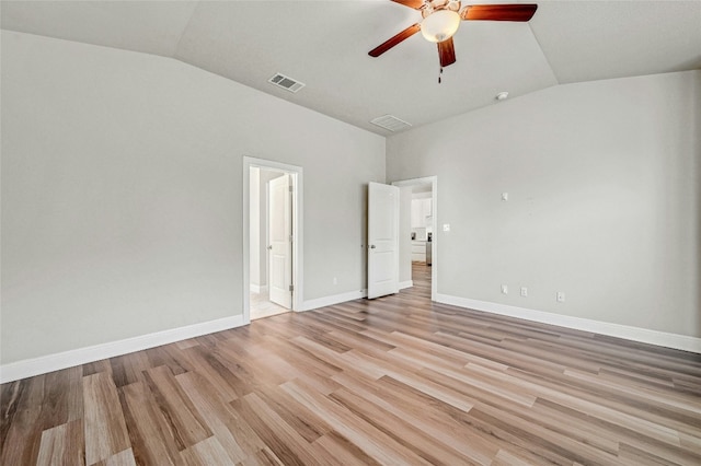 365 Victoria Peak Loop, Dripping Springs, TX 78620 - unfurnished bedroom with vaulted ceiling, light wood-type flooring, baseboards, ceiling fan, and ensuite bathroom