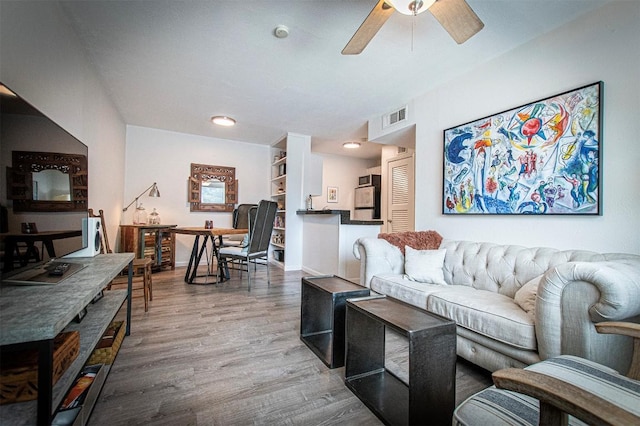 4306 Ave A Unit 105, Austin, TX 78751 - living room with wood finished floors and ceiling fan
