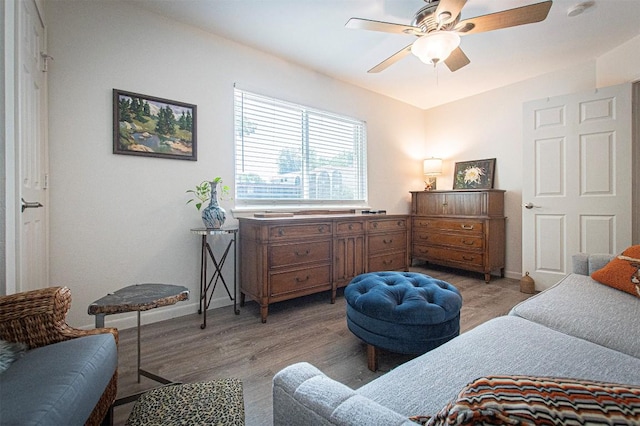 4306 Ave A Unit 105, Austin, TX 78751 - bedroom featuring light wood finished floors, a ceiling fan, and baseboards