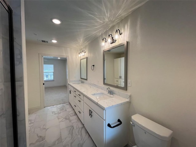 2105 Tiger Trl Unit 603, Round Rock, TX 78665 - bathroom with double vanity, marble finish floors, toilet, and recessed lighting