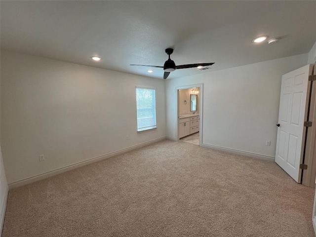 2105 Tiger Trl Unit 603, Round Rock, TX 78665 - unfurnished bedroom with recessed lighting, light colored carpet, baseboards, ensuite bath, and ceiling fan