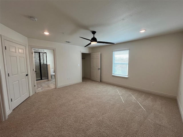 2105 Tiger Trl Unit 603, Round Rock, TX 78665 - unfurnished bedroom with light carpet, baseboards, ensuite bathroom, a ceiling fan, and recessed lighting