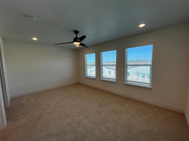 2105 Tiger Trl Unit 603, Round Rock, TX 78665 - empty room with light colored carpet, baseboards, a ceiling fan, and recessed lighting