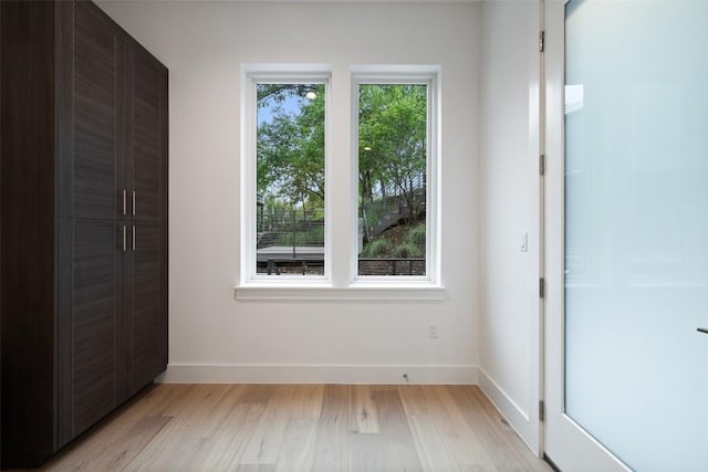 900 S 2nd St Unit 20, Austin, TX 78704 - unfurnished bedroom with light wood finished floors and baseboards