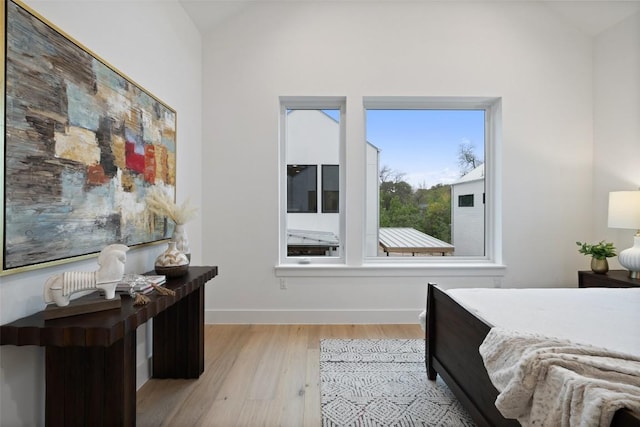 900 S 2nd St Unit 20, Austin, TX 78704 - bedroom with lofted ceiling, light wood-type flooring, and baseboards