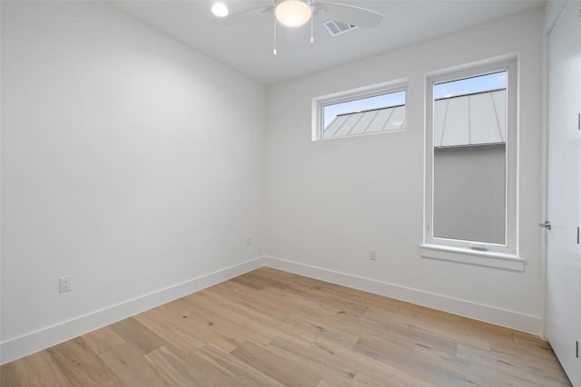 900 S 2nd St Unit 20, Austin, TX 78704 - unfurnished room featuring ceiling fan, light wood-type flooring, and baseboards