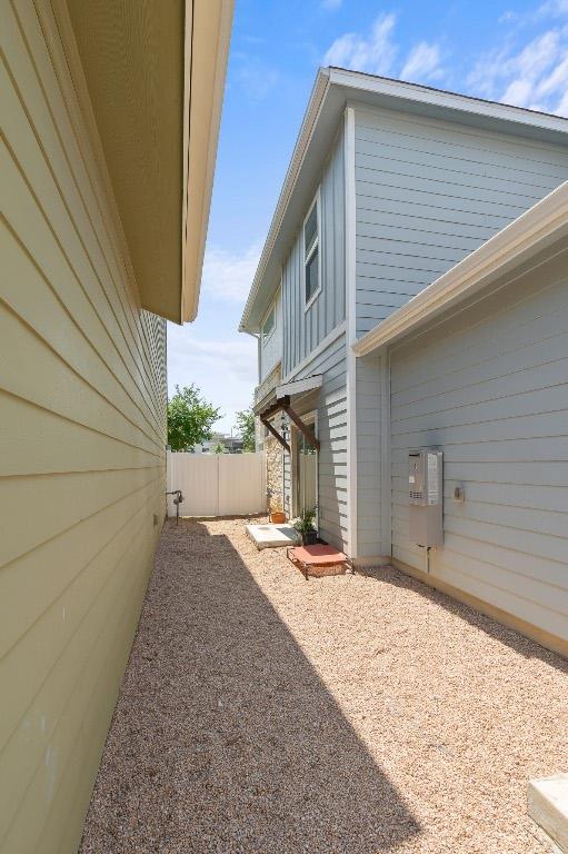 8012 Mandela Bnd, Austin, TX 78744 - view of home's exterior featuring a patio area