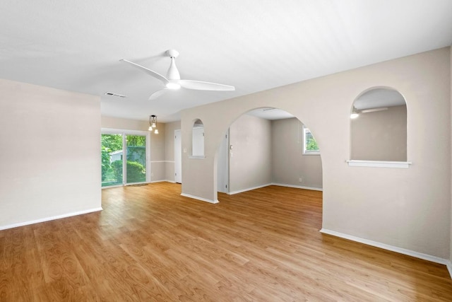3103 Steck Ave, Austin, TX 78757 - empty room featuring a ceiling fan, baseboards, and light wood-style flooring