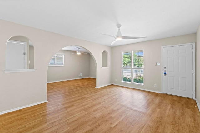 3103 Steck Ave, Austin, TX 78757 - unfurnished living room with a ceiling fan, light wood-style flooring, and baseboards