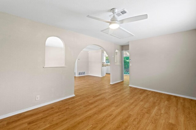 3103 Steck Ave, Austin, TX 78757 - unfurnished room featuring a ceiling fan, baseboards, and light wood-style flooring