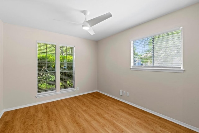 3103 Steck Ave, Austin, TX 78757 - unfurnished room featuring wood finished floors, baseboards, and ceiling fan