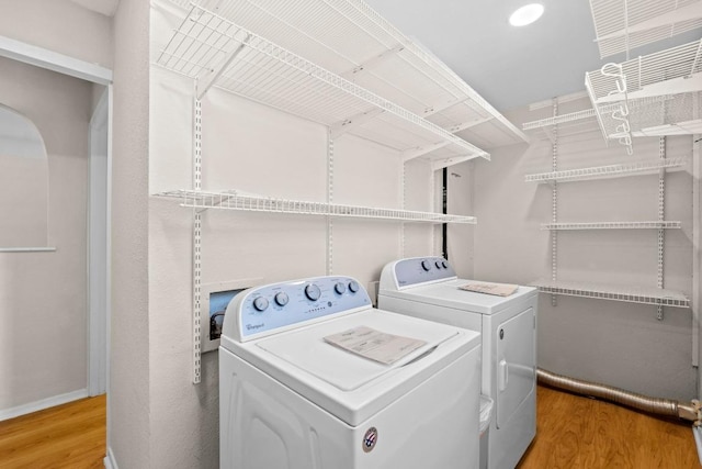 3103 Steck Ave, Austin, TX 78757 - washroom featuring independent washer and dryer and light wood-style floors