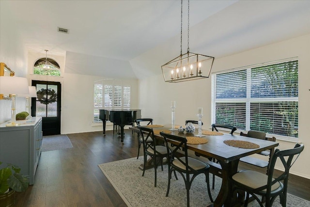 10807 Pinkney Ln, Austin, TX 78739 - dining space with dark wood-style flooring and a chandelier
