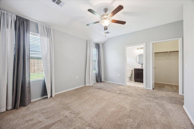 3620 Breckenridge Dr, Austin, TX 78744 - unfurnished bedroom with carpet floors, connected bathroom, baseboards, and a ceiling fan