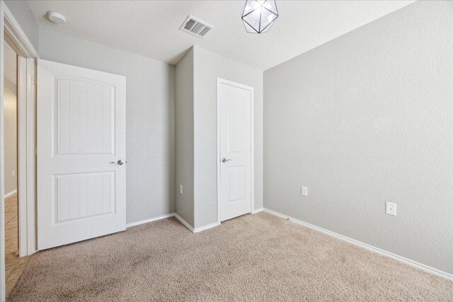 3620 Breckenridge Dr, Austin, TX 78744 - unfurnished bedroom with light carpet and baseboards