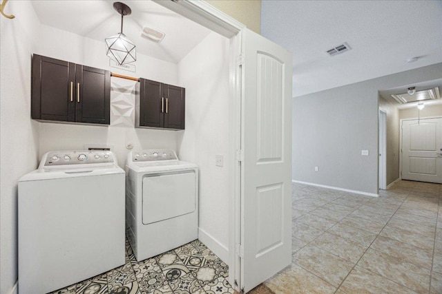3620 Breckenridge Dr, Austin, TX 78744 - laundry area featuring cabinet space, washer and dryer, attic access, baseboards, and light tile patterned floors