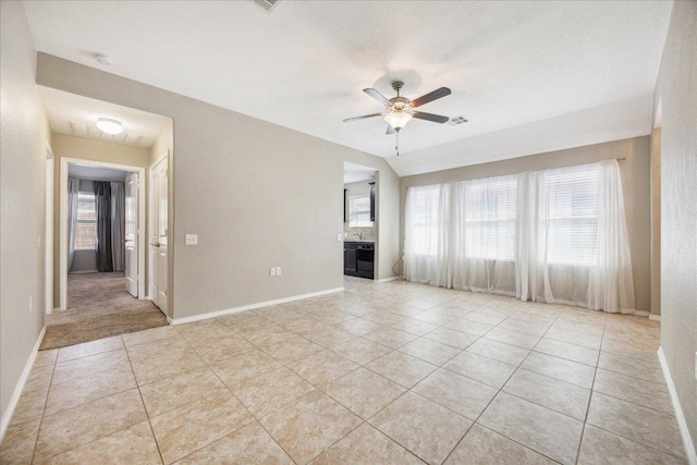 3620 Breckenridge Dr, Austin, TX 78744 - unfurnished living room featuring light tile patterned floors, a ceiling fan, and baseboards