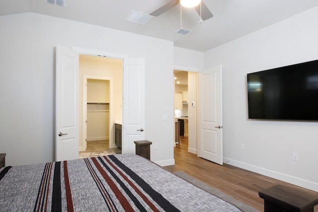 1524 Dancing Oak Ln, San Marcos, TX 78666 - bedroom with light wood finished floors and ceiling fan