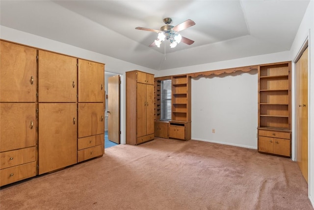 356 Cedar Ln, Cedar Creek, TX 78612 - unfurnished bedroom featuring light carpet, a raised ceiling, and ceiling fan