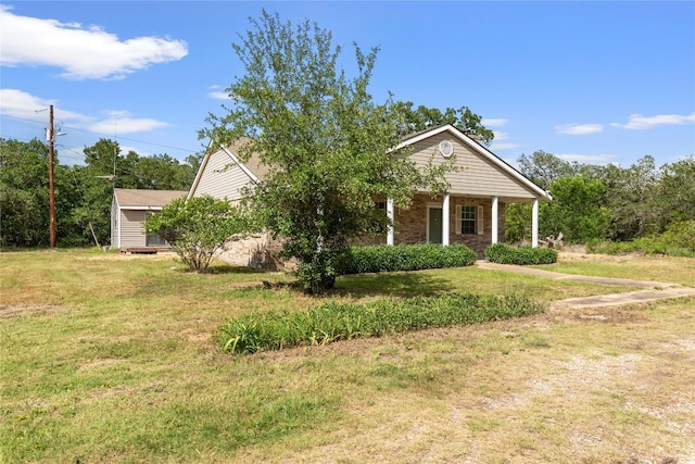 356 Cedar Ln, Cedar Creek, TX 78612 - view of front of property with a front lawn and a porch