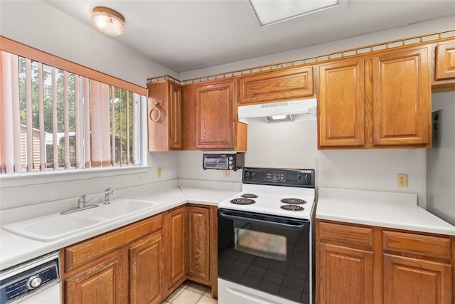 356 Cedar Ln, Cedar Creek, TX 78612 - kitchen featuring electric range oven, under cabinet range hood, white dishwasher, light tile patterned floors, and brown cabinetry
