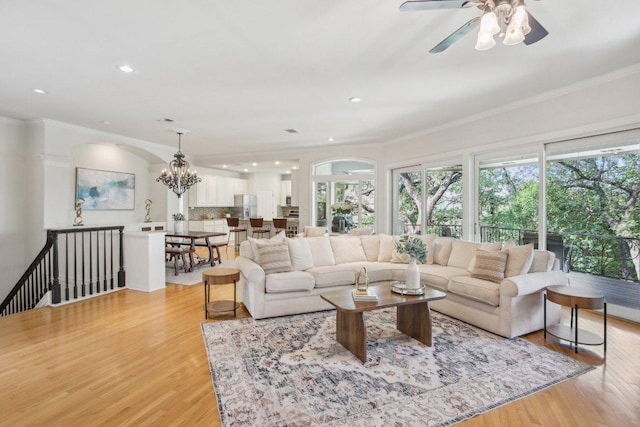 2302 Bahama Rd, Austin, TX 78733 - living room with plenty of natural light, light wood finished floors, crown molding, recessed lighting, and a chandelier