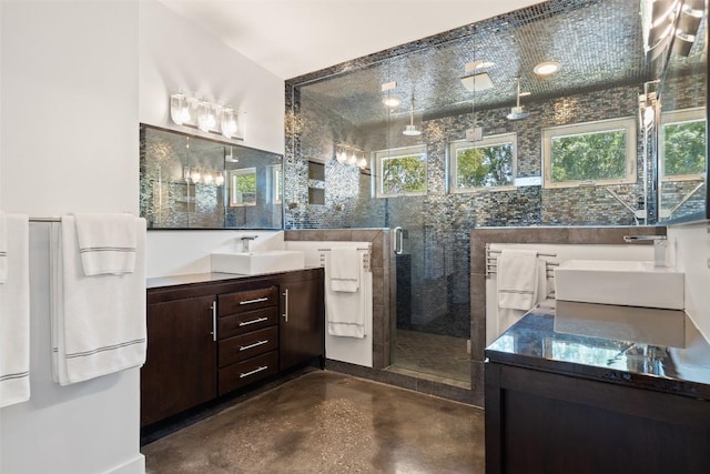 7517 Saint Louis St, Austin, TX 78757 - bathroom with two vanities, concrete floors, and a stall shower