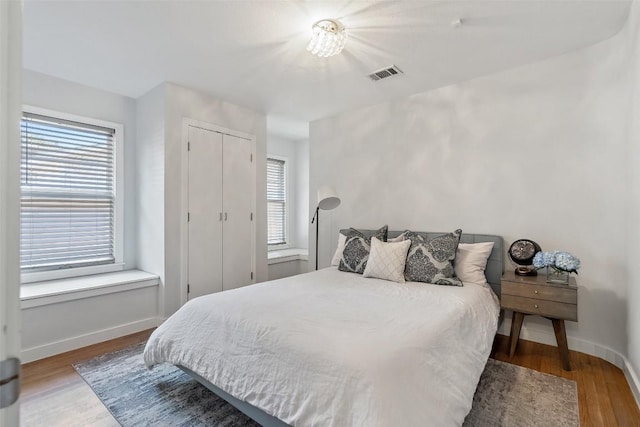 7517 Saint Louis St, Austin, TX 78757 - bedroom featuring wood finished floors and baseboards