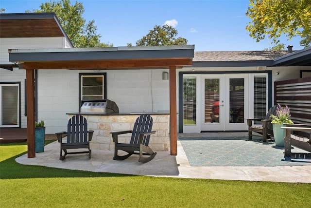 7517 Saint Louis St, Austin, TX 78757 - back of house featuring a patio, french doors, and a yard