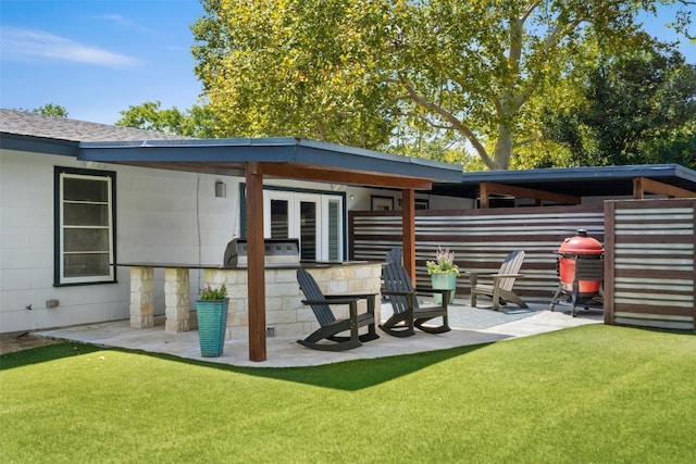 7517 Saint Louis St, Austin, TX 78757 - rear view of property with a patio, a lawn, an outdoor kitchen, and french doors