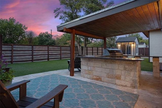7517 Saint Louis St, Austin, TX 78757 - patio terrace at dusk with a patio and an outdoor structure