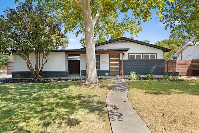 7517 Saint Louis St, Austin, TX 78757 - view of front of property featuring brick siding and covered porch