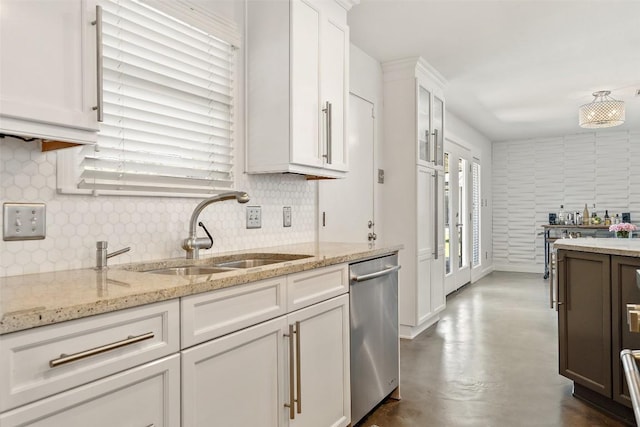 7517 Saint Louis St, Austin, TX 78757 - kitchen with dishwasher, a sink, white cabinetry, tasteful backsplash, and light stone counters